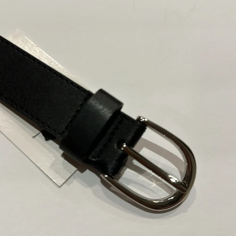 Black Vegan leather belt with silver tone buckle fits approximately 31-36”